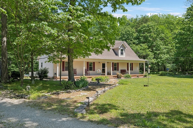 farmhouse featuring a porch and a front lawn