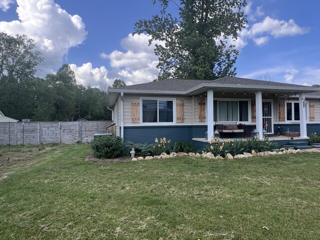 216 1st St, Monteagle, TN 37356 - view of front of property featuring brick siding, fence, outdoor lounge area, and a front lawn