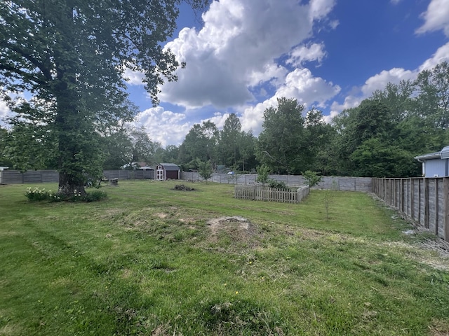 216 1st St, Monteagle, TN 37356 - view of yard with a fenced backyard, an outdoor structure, and a shed