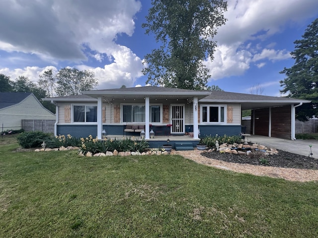 216 1st St, Monteagle, TN 37356 - view of front of property with a front yard, an outdoor living space, brick siding, driveway, and a carport