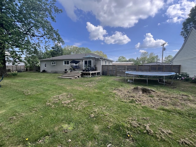 216 1st St, Monteagle, TN 37356 - view of yard with a trampoline, fence, and a deck