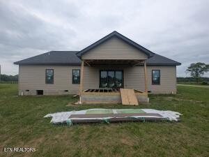 238 Thacker Rd, Grimsley, TN 38565 - back of house featuring a yard