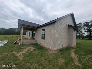 238 Thacker Rd, Grimsley, TN 38565 - view of side of home with crawl space and a yard