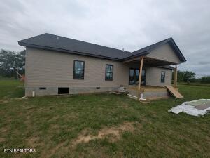 238 Thacker Rd, Grimsley, TN 38565 - back of house with a yard and a patio area