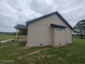 238 Thacker Rd, Grimsley, TN 38565 - view of side of home with crawl space and a lawn