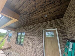 238 Thacker Rd, Grimsley, TN 38565 - doorway to property with brick siding