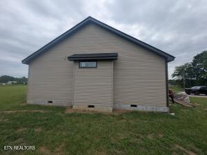 238 Thacker Rd, Grimsley, TN 38565 - view of side of home featuring crawl space and a lawn
