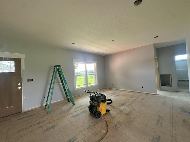 238 Thacker Rd, Grimsley, TN 38565 - unfurnished living room featuring a textured ceiling