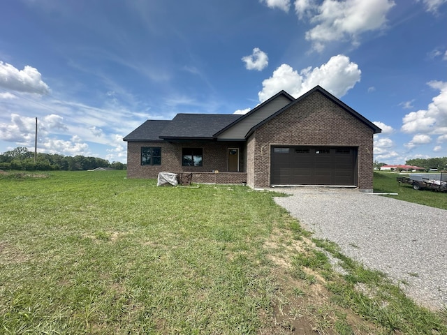 238 Thacker Rd, Grimsley, TN 38565 - view of front of home with driveway, brick siding, a garage, and a front lawn