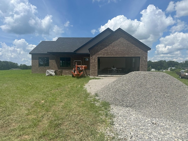 238 Thacker Rd, Grimsley, TN 38565 - single story home featuring brick siding, a garage, driveway, and a front lawn