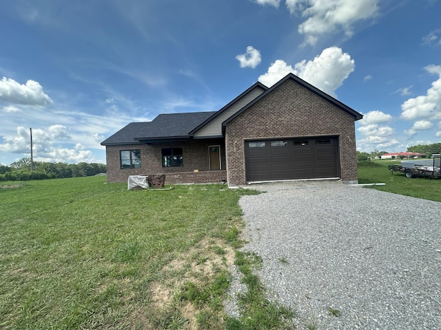 238 Thacker Rd, Grimsley, TN 38565 - single story home with gravel driveway, brick siding, a garage, and a front lawn