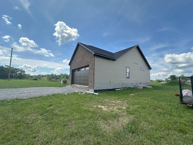 238 Thacker Rd, Grimsley, TN 38565 - view of side of home with a yard, a garage, and crawl space