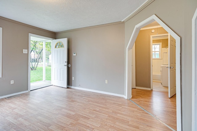 300 E Highland Dr, Columbia, TN 38401 - unfurnished room with a wealth of natural light, a textured ceiling, light wood-type flooring, and baseboards