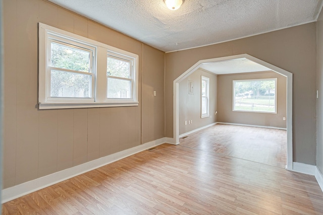 300 E Highland Dr, Columbia, TN 38401 - interior space featuring light wood-style flooring, a wealth of natural light, and a textured ceiling
