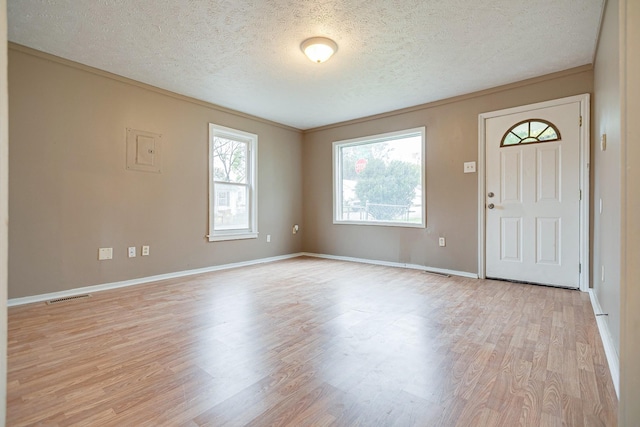 300 E Highland Dr, Columbia, TN 38401 - entrance foyer featuring visible vents, light wood-style flooring, a textured ceiling, and baseboards