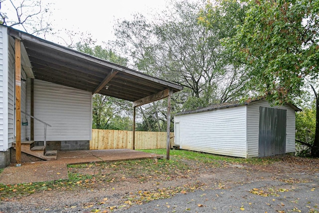 300 E Highland Dr, Columbia, TN 38401 - view of vehicle parking with a storage unit and fence
