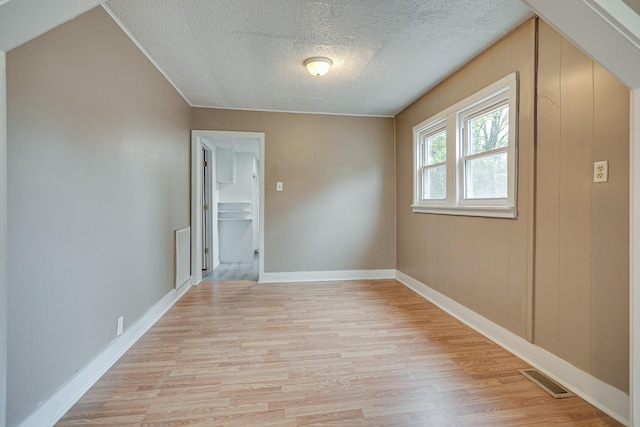 300 E Highland Dr, Columbia, TN 38401 - empty room with baseboards, visible vents, a textured ceiling, and light wood-style floors