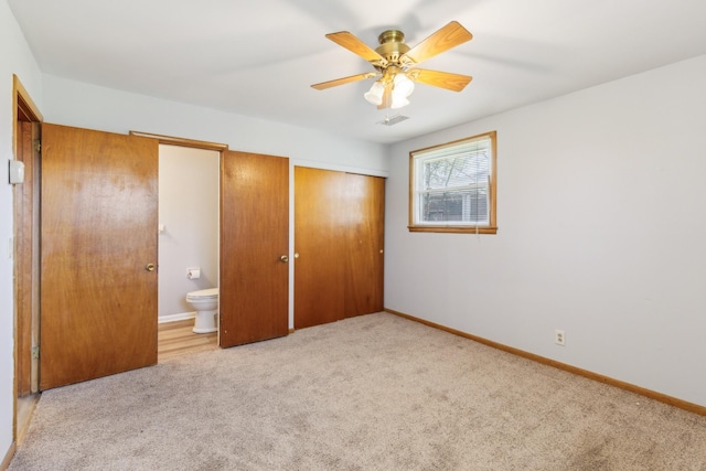unfurnished bedroom with baseboards, visible vents, and carpet floors
