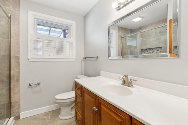 bathroom with tile patterned flooring, a shower stall, a baseboard heating unit, toilet, and vanity