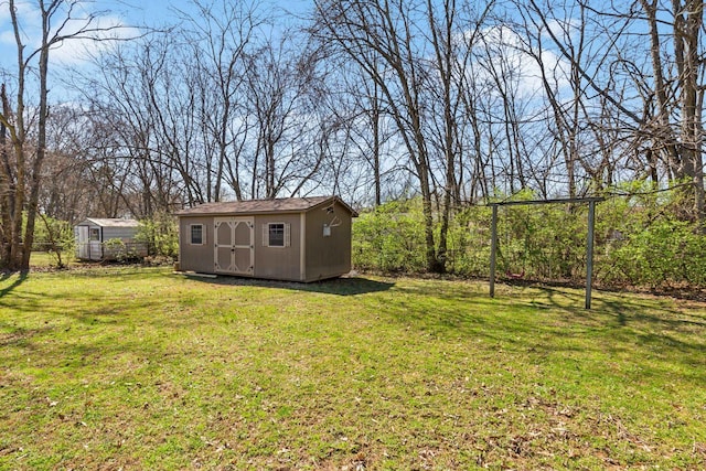 view of yard with an outbuilding and a storage shed