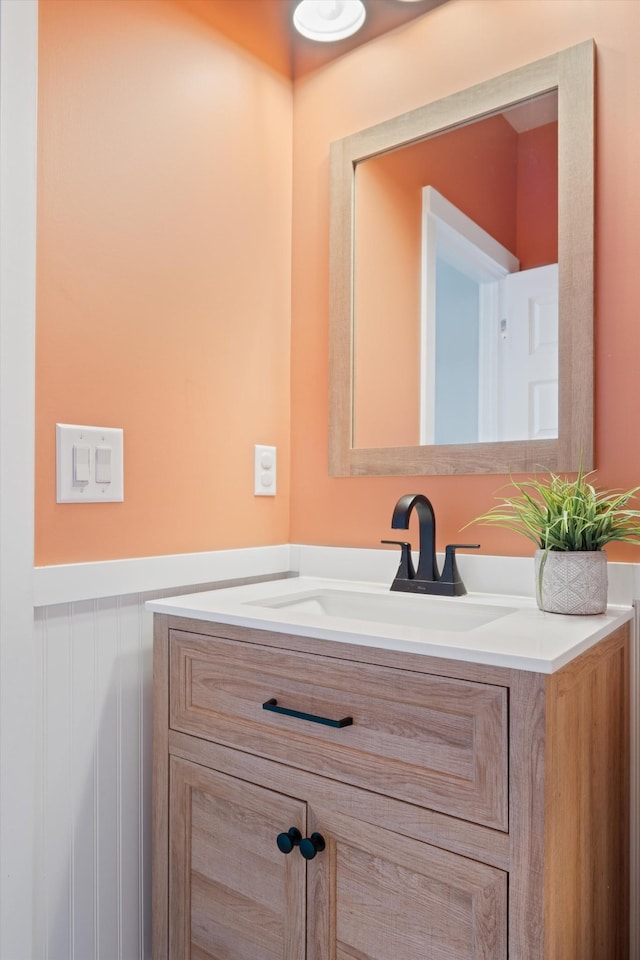 bathroom featuring wainscoting and vanity