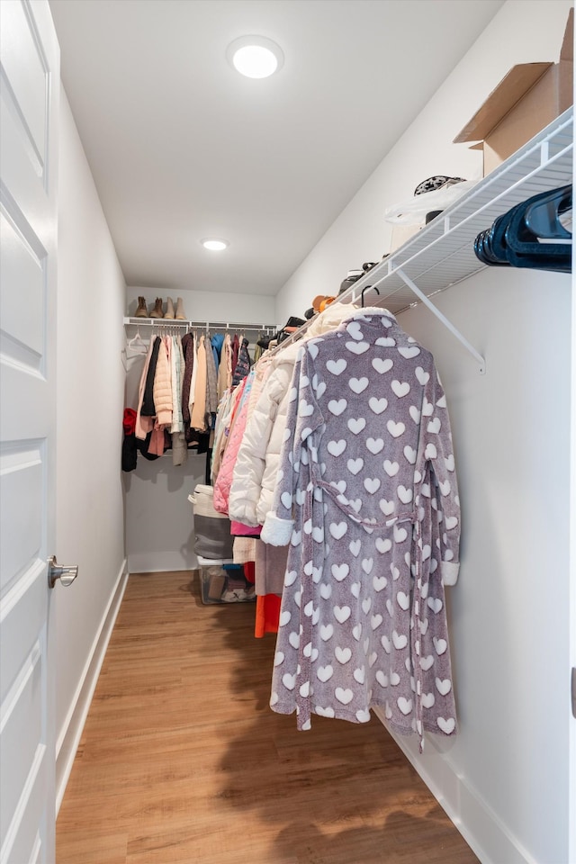 spacious closet with wood finished floors
