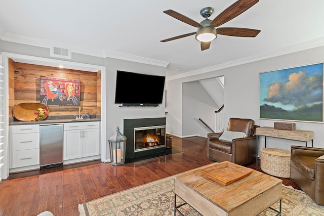 401 Bowling Ave Unit 31, Nashville, TN 37205 - living area with visible vents, ornamental molding, wet bar, and hardwood / wood-style floors