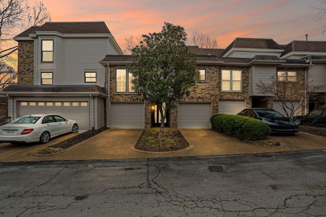 401 Bowling Ave Unit 31, Nashville, TN 37205 - view of property with brick siding, driveway, and an attached garage