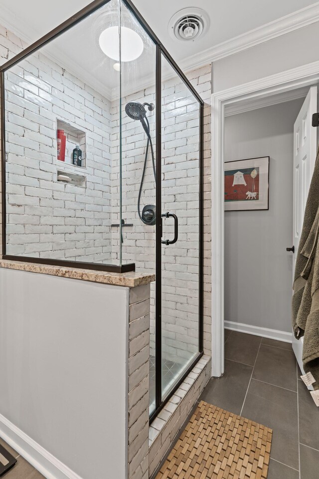 401 Bowling Ave Unit 31, Nashville, TN 37205 - bathroom with visible vents, a stall shower, and ornamental molding