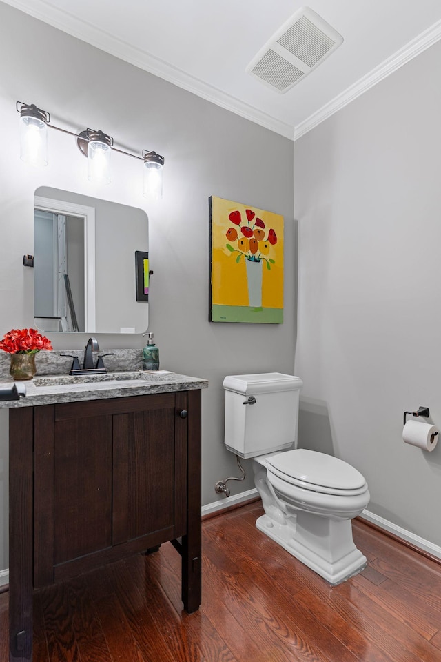 401 Bowling Ave Unit 31, Nashville, TN 37205 - half bathroom with toilet, wood finished floors, visible vents, and ornamental molding