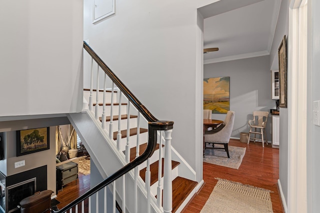 401 Bowling Ave Unit 31, Nashville, TN 37205 - staircase featuring wood finished floors, baseboards, and ornamental molding
