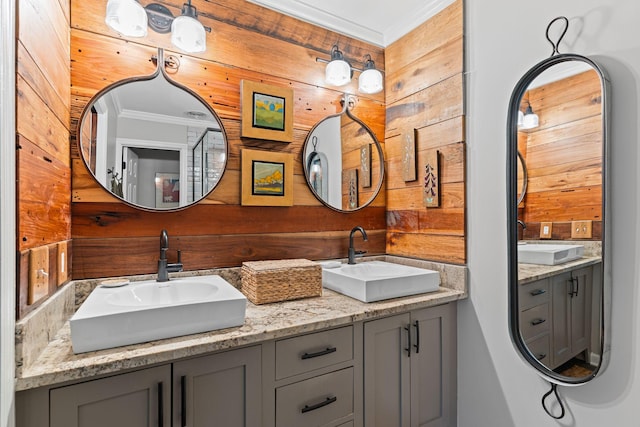 401 Bowling Ave Unit 31, Nashville, TN 37205 - bathroom with a sink, ornamental molding, double vanity, and wood walls