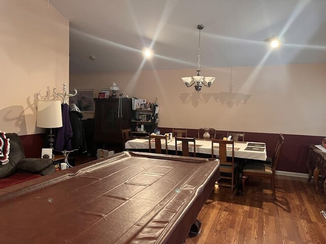 playroom with a chandelier, wood finished floors, and pool table