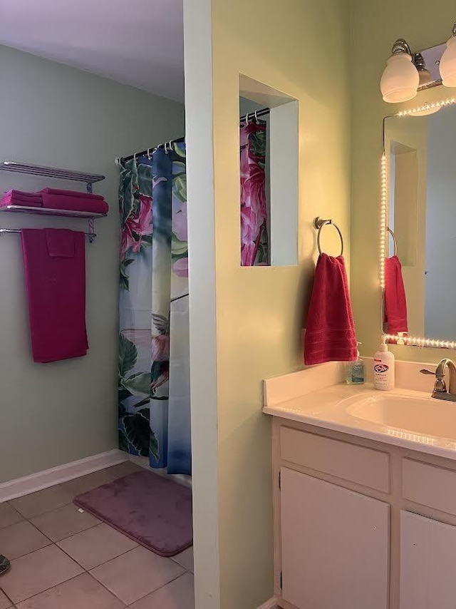 bathroom with tile patterned floors, vanity, and a shower with shower curtain