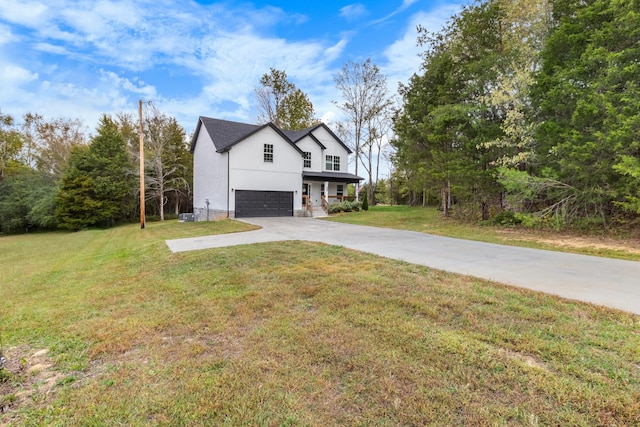 1289 Southside Rd, Southside, TN 37171 - view of side of home featuring concrete driveway, a yard, and a garage