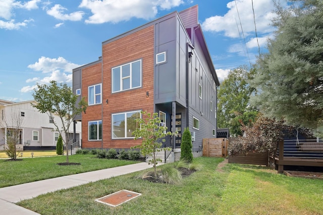 1815 14th Ave N Unit B, Nashville, TN 37208 - exterior space with board and batten siding and a front lawn