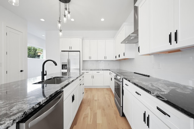 1815 14th Ave N Unit B, Nashville, TN 37208 - kitchen featuring a sink, white cabinets, appliances with stainless steel finishes, and wall chimney range hood