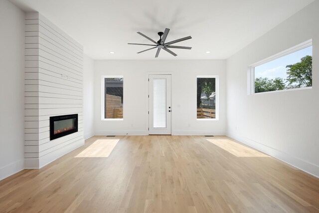 1815 14th Ave N Unit B, Nashville, TN 37208 - unfurnished living room featuring recessed lighting, a large fireplace, light wood-style floors, a ceiling fan, and baseboards