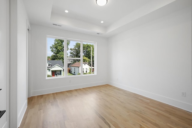 1815 14th Ave N Unit B, Nashville, TN 37208 - empty room with baseboards, visible vents, light wood-style floors, and a tray ceiling