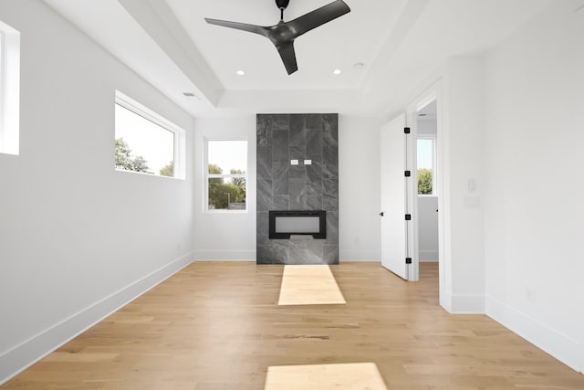 1815 14th Ave N Unit B, Nashville, TN 37208 - unfurnished living room featuring light wood-style floors, baseboards, recessed lighting, a premium fireplace, and a ceiling fan