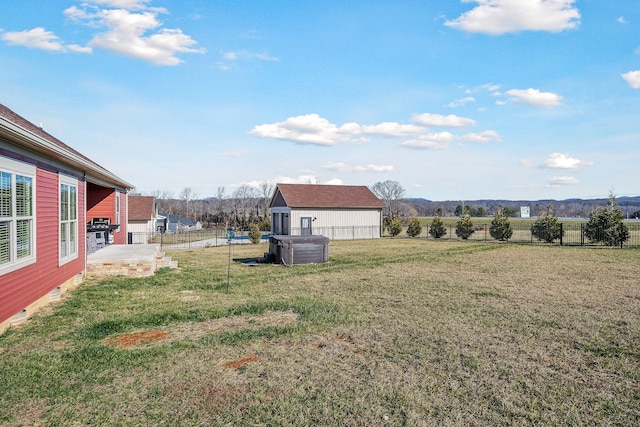 view of yard featuring a mountain view, fence, and a patio