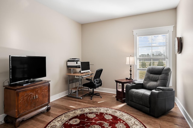 office area with wood finished floors and baseboards