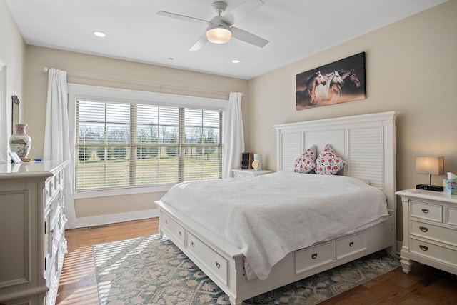 bedroom featuring recessed lighting, ceiling fan, baseboards, and wood finished floors