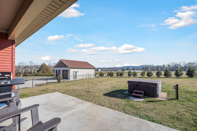 view of patio / terrace featuring an outdoor structure, fence, and a hot tub