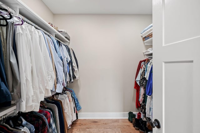 spacious closet featuring wood finished floors