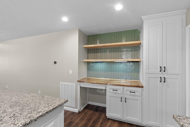 530 S Oak St, Hohenwald, TN 38462 - kitchen featuring dark wood-style floors, visible vents, white cabinets, and wooden counters