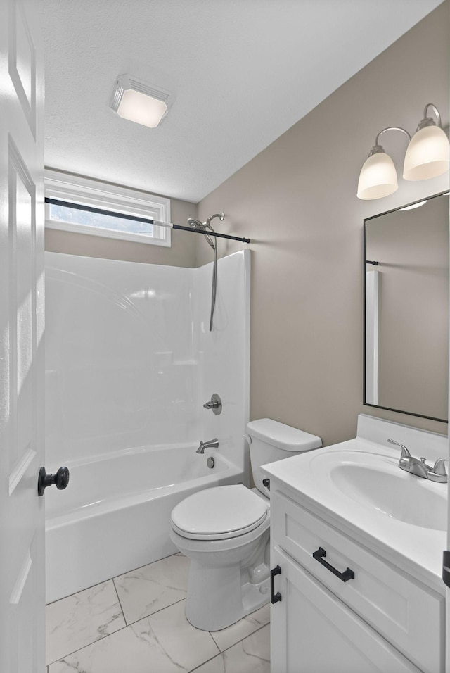 530 S Oak St, Hohenwald, TN 38462 - full bath featuring vanity, marble finish floor, toilet, and shower / washtub combination
