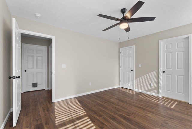530 S Oak St, Hohenwald, TN 38462 - unfurnished bedroom with baseboards, a ceiling fan, and wood finished floors