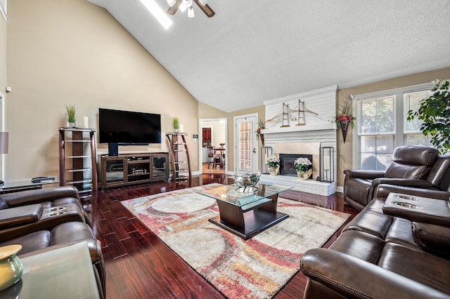 1712 Lake Grassland W, Gallatin, TN 37066 - living room featuring a brick fireplace, baseboards, ceiling fan, high vaulted ceiling, and dark wood-style flooring