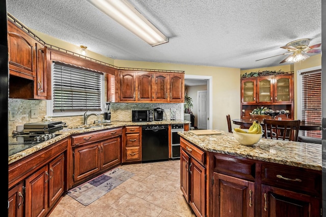 1712 Lake Grassland W, Gallatin, TN 37066 - kitchen with tasteful backsplash, light stone countertops, dishwasher, a ceiling fan, and a sink